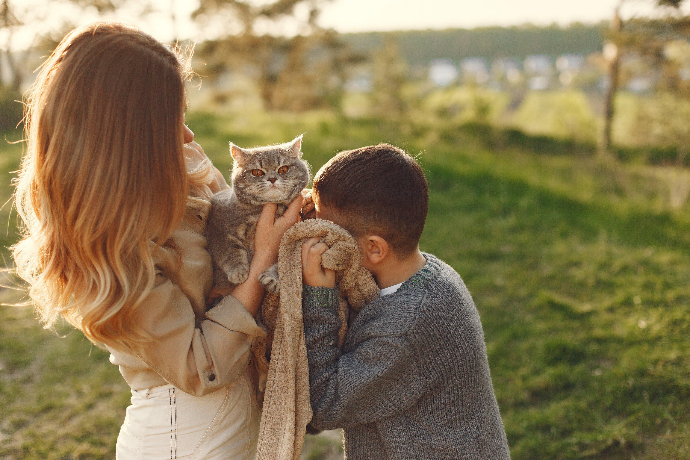 Mother and Son with Cat Outdoors